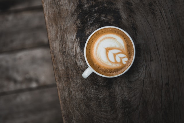 a latte on the edge of a table